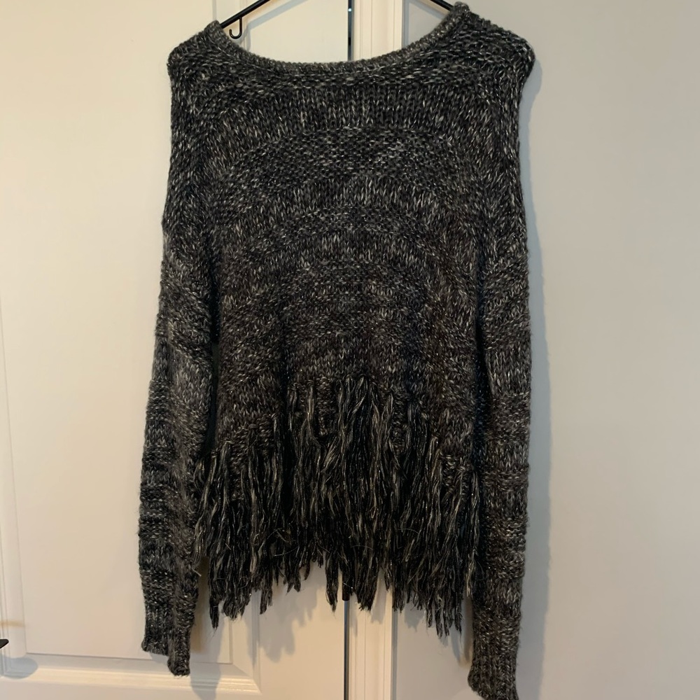 Warm sweater fringed at bottom!